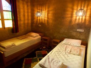 Katil atau katil-katil dalam bilik di Chambres dans casbah - Gite D'étape Gorges De Ziz