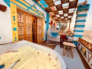 a room with a table and a tub of food at Kato Dool Wellness Resort in Aswan