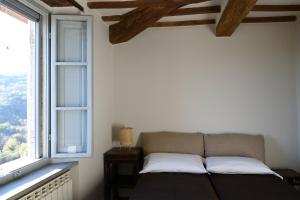 Postel nebo postele na pokoji v ubytování Albergo La Pietra