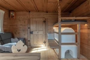 a bedroom with a bunk bed in a cabin at Chalet Laugenblick in Santa Valburga St. Walburg +54 photos
