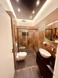 a bathroom with a toilet and a sink and a shower at holidayAHRpartment in Bad Neuenahr-Ahrweiler