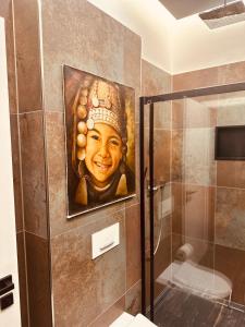 a painting of a head on a wall in a bathroom at holidayAHRpartment in Bad Neuenahr-Ahrweiler +8 photos