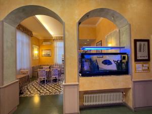 a hallway with an aquarium in a room at Hotel Villa Primavera in Pisa