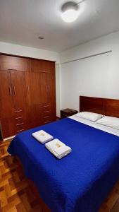A bed or beds in a room at Departamento completo Chanchamayo