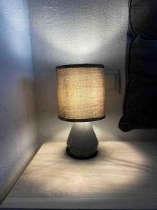 a small lamp sitting on a table in a bedroom at ¡Más céntrico imposible! 6Pax+PK in Andorra la Vella