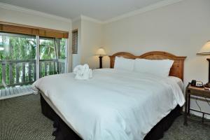 Un pat sau paturi într-o cameră la Villas at Eldorado Resort