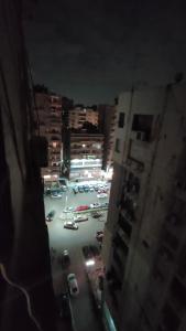 a view of a parking lot in a city at night at شقة انور المفتى للعائلات فقط 113 in Cairo