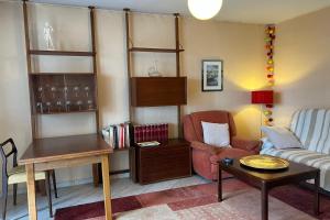 a living room with a couch and a chair at #EV Le Taillat T3 for 4 in Meylan with Terrace in Meylan