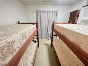 Una cama o camas cuchetas en una habitación  de salta 1019 Apart Firmat 5