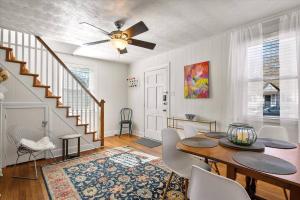 a dining room with a table and a ceiling fan at Private House Mins to Maymont Park, Trails & VCU! in Richmond