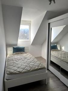 Posteľ alebo postele v izbe v ubytovaní Appartement F5 maison de maitre