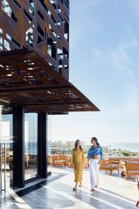 two women walking on the roof of a building at Zadún, a Ritz-Carlton Reserve in San José del Cabo