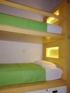 a bedroom with two bunk beds in a room at Magic Jardín Hostel in Jardin
