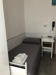 Postel nebo postele na pokoji v ubytování Hotel Oria