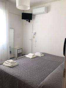 Postel nebo postele na pokoji v ubytování Hotel Oria