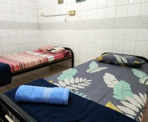 Un ou plusieurs lits dans un hébergement de l'établissement Tatai Kumang Homestay