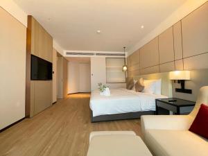 Postel nebo postele na pokoji v ubytování Kew Green Hotel Hongqiao Shanghai