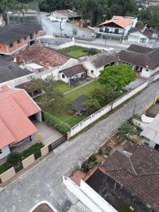 an aerial view of a city with houses at Apartamento residencial in Blumenau