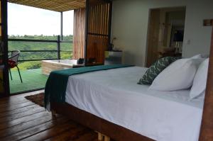 Ένα ή περισσότερα κρεβάτια σε δωμάτιο στο GLAMPING CAFETOS