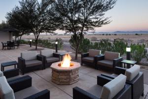 a patio with chairs and a fire pit at Fairfield Inn and Suites Phoenix Chandler Fashion Center in Chandler