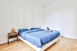 Posteľ alebo postele v izbe v ubytovaní Appartement Quartier Le Marais 2 Free Netflix