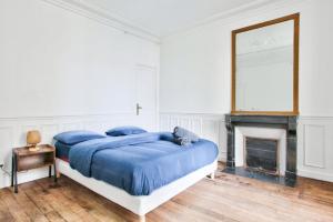 Posteľ alebo postele v izbe v ubytovaní Appartement Quartier Le Marais 2 Free Netflix