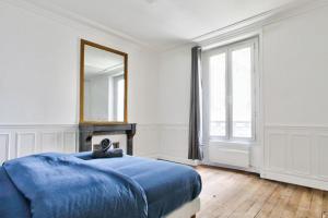 Posteľ alebo postele v izbe v ubytovaní Appartement Quartier Le Marais 2 Free Netflix