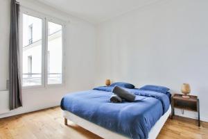 Posteľ alebo postele v izbe v ubytovaní Appartement Quartier Le Marais 2 Free Netflix