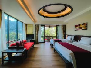 En eller flere senger på et rom på Aonang Phu Pi Maan Resort & Spa