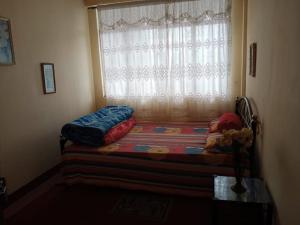 Postel nebo postele na pokoji v ubytování Backpackers Hostel