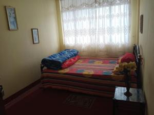 Postel nebo postele na pokoji v ubytování Backpackers Hostel