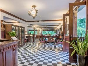 a living room with a checkered floor at Chateau d'Angkor La Residence in Siem Reap