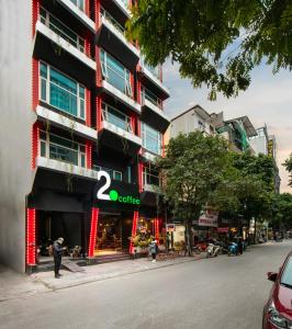 a building with a office sign on the side of it at Hai Mươi Hotel & Apartment in Hanoi