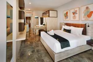 Postel nebo postele na pokoji v ubytování Graha Socio Hotel Nusa Dua Bali
