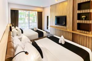 TV a/nebo společenská místnost v ubytování Graha Socio Hotel Nusa Dua Bali