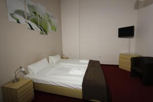 Postel nebo postele na pokoji v ubytování Hotel Elegia am Kurfürstendamm