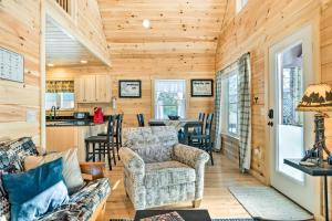 a living room with a couch and chairs in a cabin at Maine Cabin Rental on Rangeley Lake! in Rangeley