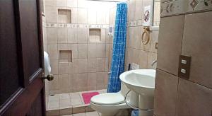 a bathroom with a sink and a toilet and a shower at Coco Beach Condos in Guanacaste