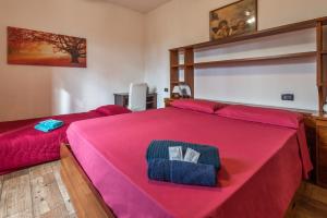 A bed or beds in a room at B&B Selvarossa