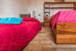 A bed or beds in a room at B&B Selvarossa