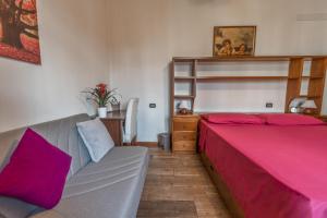 A bed or beds in a room at B&B Selvarossa