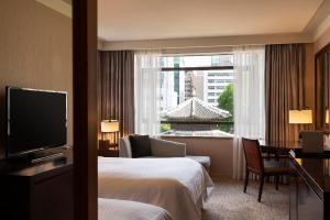 a hotel room with a bed and a window at Westin Josun Seoul Hotel in Seoul