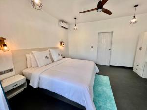 Voodi või voodid majutusasutuse Seaside Dhigurah toas