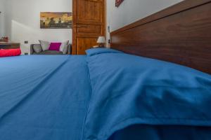 A bed or beds in a room at B&B Selvarossa