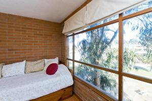 Postel nebo postele na pokoji v ubytování Linda Vista Apart Hotel