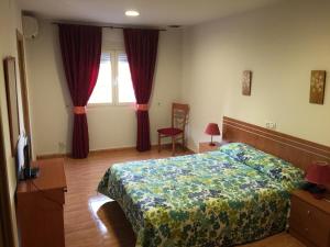 Posteľ alebo postele v izbe v ubytovaní Hotel Godofredo