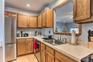 a kitchen with wooden cabinets and a sink at Poconos Retreat, 6 Mi to Shawnee Mountain Ski Area in East Stroudsburg