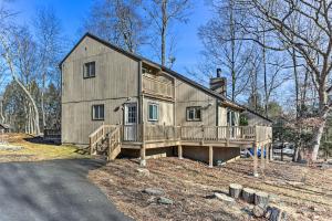 a large house with a porch and a deck at Poconos Retreat, 6 Mi to Shawnee Mountain Ski Area in East Stroudsburg