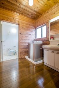 a bathroom with a shower and a sink and a tub at Stella Rental Villa Engawa House in Fujikawaguchiko