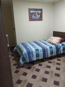 Cama o camas de una habitación en Hostal MIRAMAR En Pleno Centro de Pozo Almonte